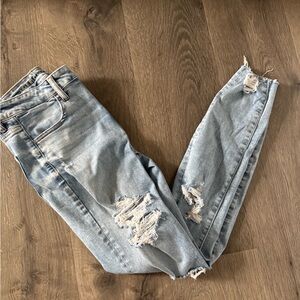 American Eagle Next Level Stretch Super High Rise Light Blue Distressed Jeggings